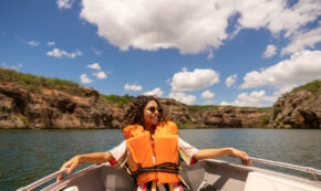 Young woman taking a boat on the São Francisco River in Canindé, Sergipe, Brazil