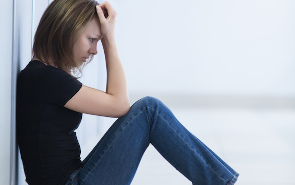 sad young woman sitting  in crisis moment