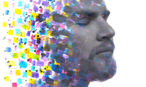 A portrait of a man combined with an abstract watercolor painting in a paintography technique to demonstrate the multitude of causes behind mental health.