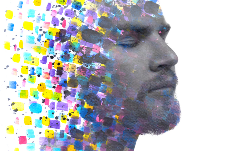 A portrait of a man combined with an abstract watercolor painting in a paintography technique to demonstrate the multitude of causes behind mental health.