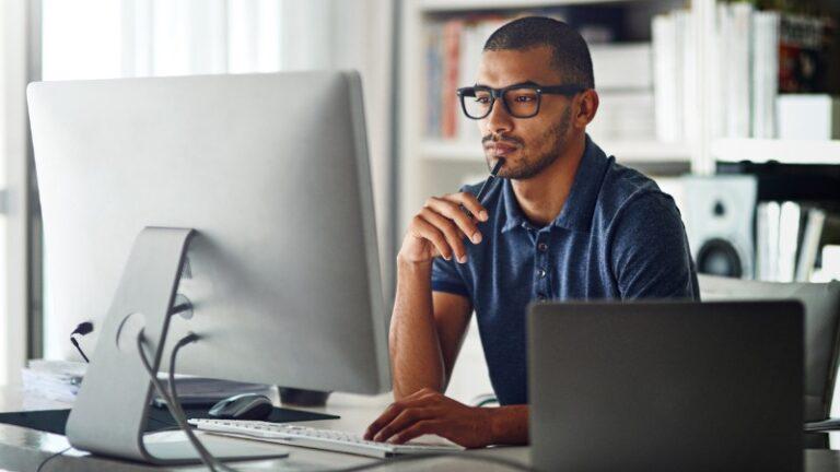 businessman using his computer in his home office