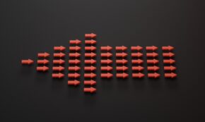 A group of 50 red arrows, individually pointing to the right, collectively form a single large arrow that is pointing to the left. The background is black. The arrows are arranged in 10 columns as follows, center to the horizontal middle of the photo: 1, 3, 5, 7, 9, 5, 5, 5, 5, 5,