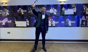 Liam J. Ryan, co-founder of Assets For Life, proudly raises the Business Growth Award bestowed by the Professional Speakers Academy, symbolizing the company's innovative success in property education and wealth training. (Photo from Liam J. Ryan)