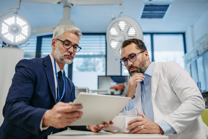 A doctor consulting a financial expert on business term loans.