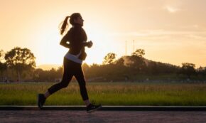 Woman running on a path at golden hour